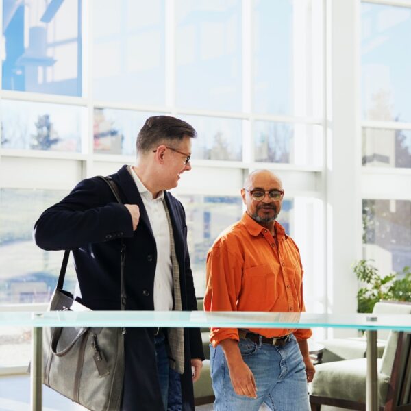 unknown persons standing indoors